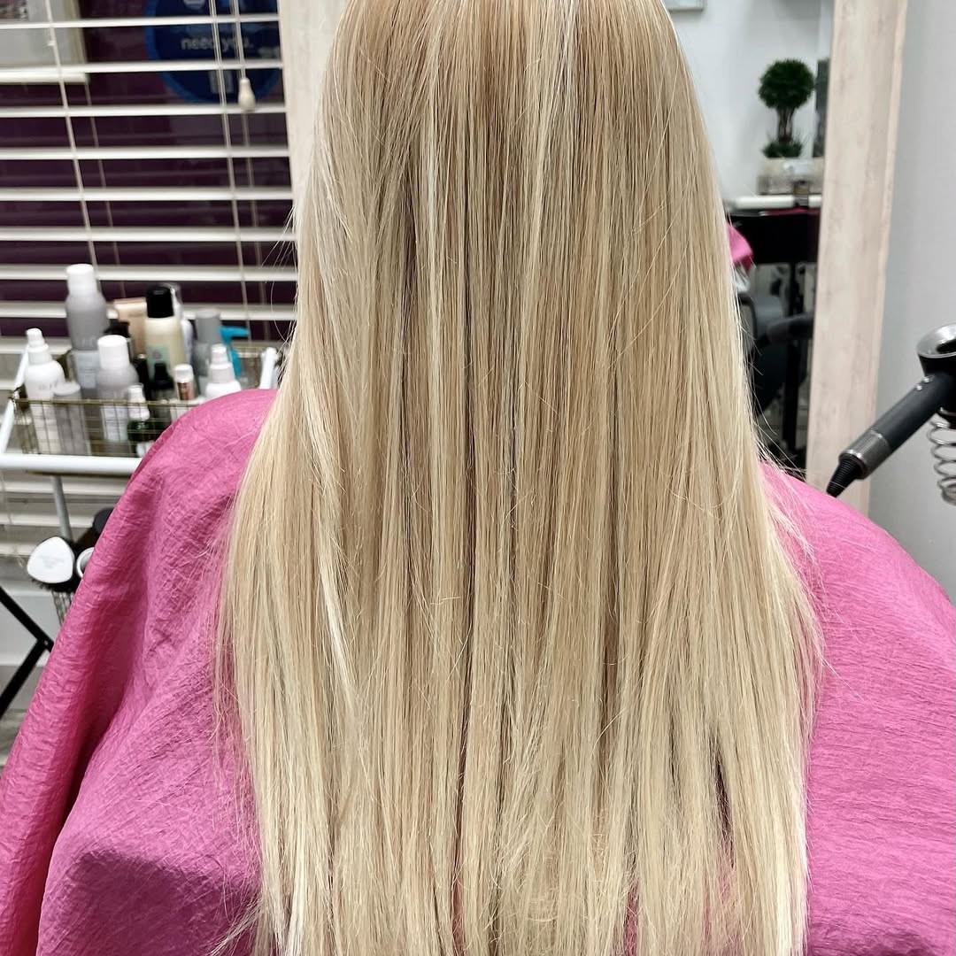Long blonde hair by Portes Beauty
